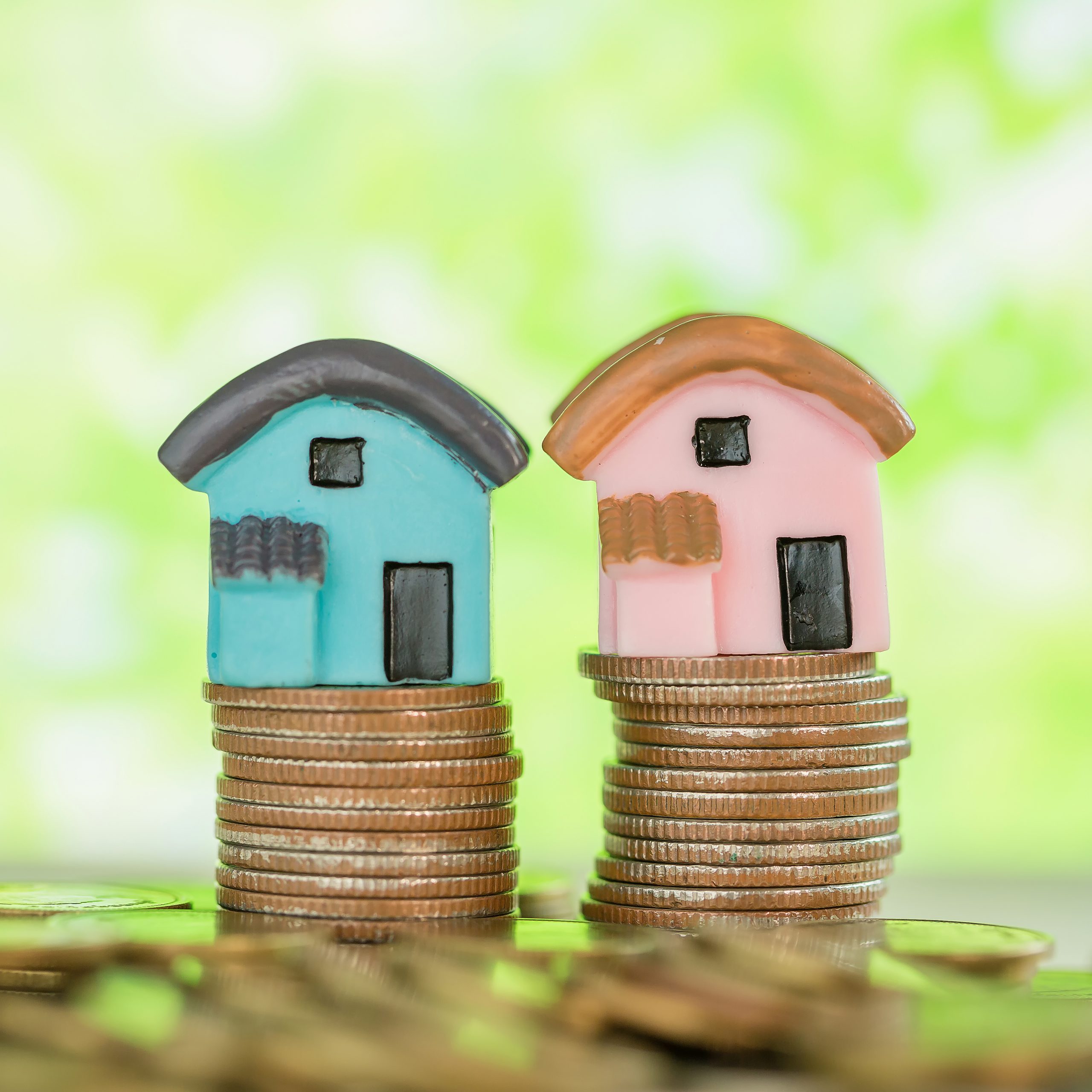 mini-house-stack-coins-with-green-blur-scaled.jpg