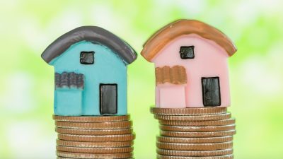 mini-house-stack-coins-with-green-blur-scaled.jpg